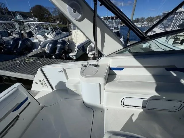 Slide: The Image of 2003 Formula 27 PC boat interior with docked yachts in the background. - 16