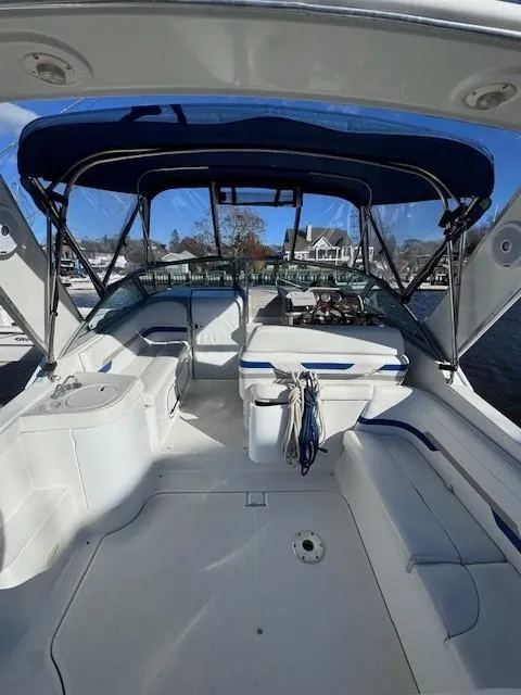 Slide: The Image of 2003 Formula 27 PC boat interior with blue canopy and seating. - 17
