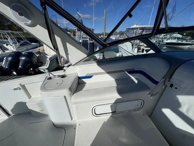 Slide: The Image of 2003 Formula 27 PC boat interior with seating and storage, docked at marina. - 18