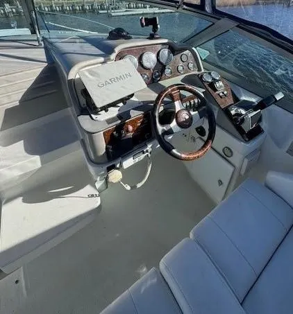 Slide: The Image of 2003 Formula 27 PC boat cockpit with Garmin navigation system and leather seating. - 25