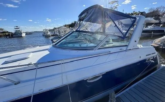 Slide: The Image of 2003 Formula 27 PC boat docked at marina under clear blue sky. - 28
