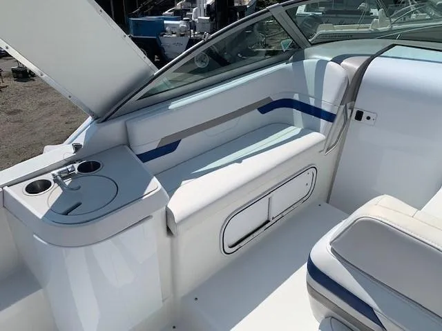 Slide: The Image of 2003 Formula 27 PC boat interior with seating and cup holders. - 7