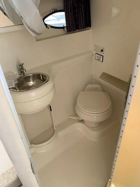 Slide: The Image of 2003 Formula 27 PC boat bathroom with sink and toilet. - 9