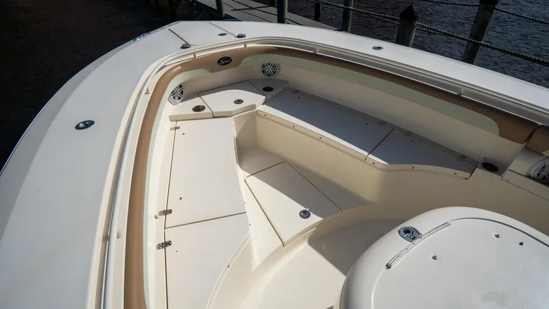Slide: The Image of 2012 Scout 345 XSF boat interior with seating and storage compartments. - 14