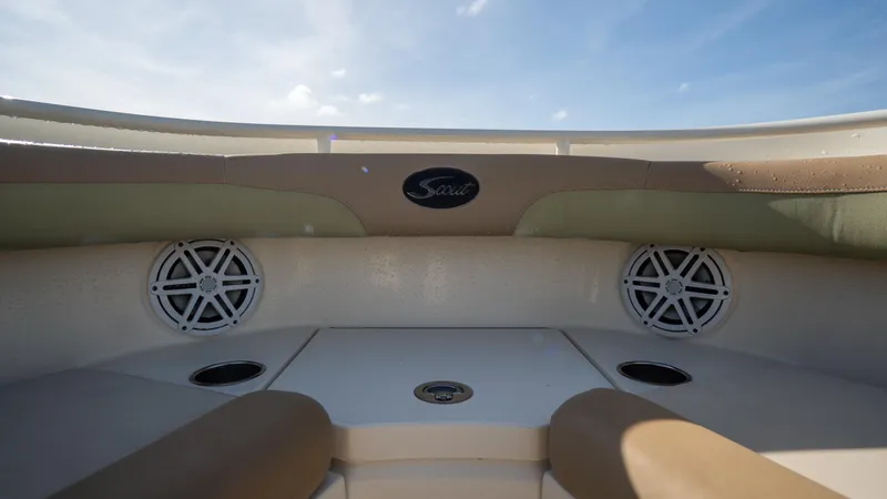 Slide: The Image of 2012 Scout 345 XSF boat interior with speakers and seating. - 21