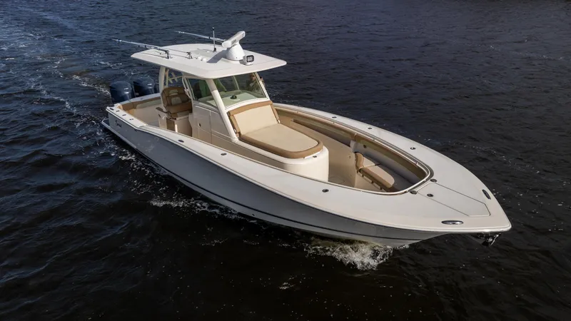Slide: The Image of 2012 Scout 345 XSF boat cruising on open water. - 24
