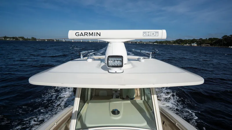 Slide: The Image of 2012 Scout 345 XSF boat with Garmin radar on open water. - 30