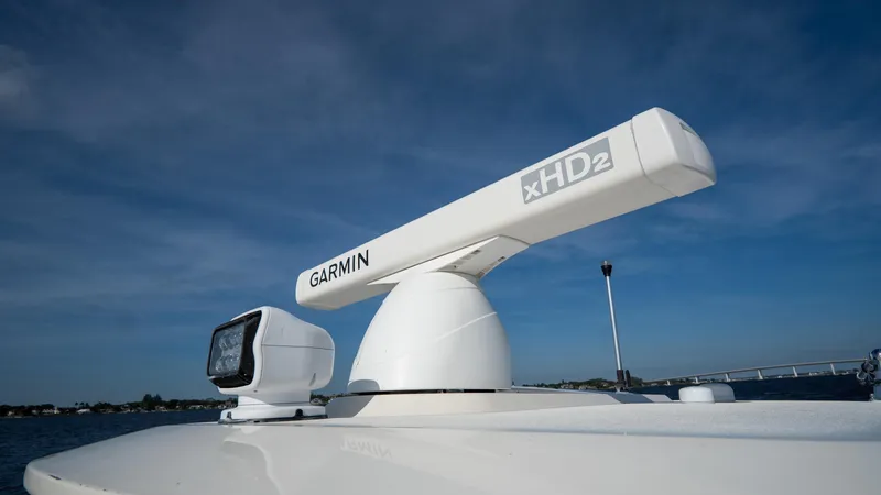 Slide: The Image of Garmin xHD2 radar on 2012 Scout 345 XSF boat under clear blue sky. - 31