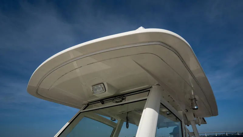 Slide: The Image of Scout 345 XSF 2012 boat roof against clear blue sky. - 32