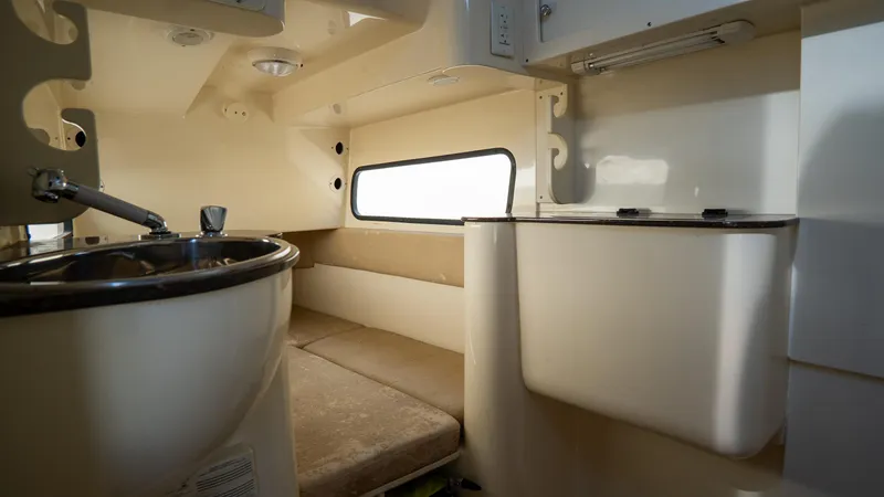 Slide: The Image of 2012 Scout 345 XSF cabin interior with sink and seating area. - 40