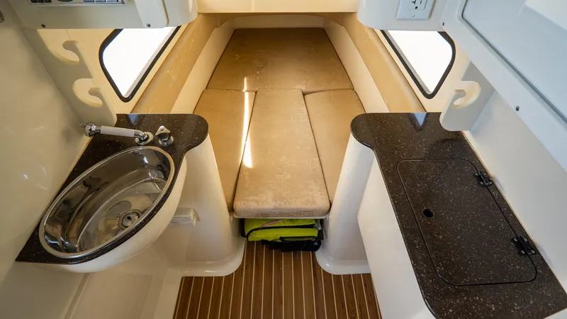Slide: The Image of 2012 Scout 345 XSF cabin interior with bed, sink, and countertop. - 41