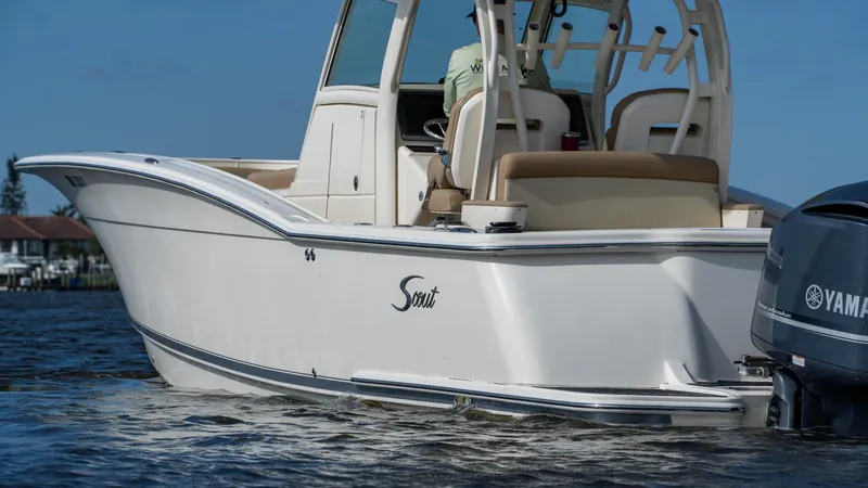 Slide: The Image of 2012 Scout 345 XSF boat on water with Yamaha engine. - 6