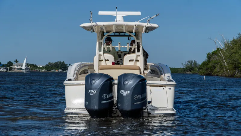 Slide: The Image of 2012 Scout 345 XSF boat with twin Yamaha engines on the water. - 7