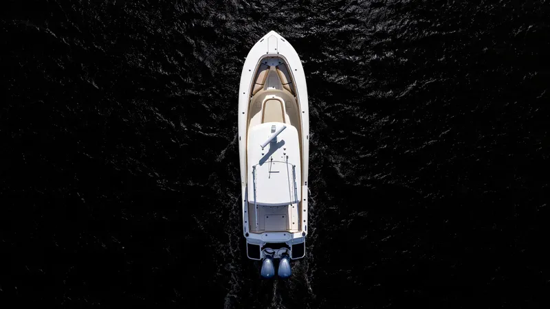 Slide: The Image of Aerial view of 2012 Scout 345 XSF boat on dark water. - 8