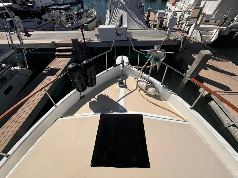 Slide: The Image of 1979 Ocean Yachts Trawler docked at marina, view from bow deck. - 24