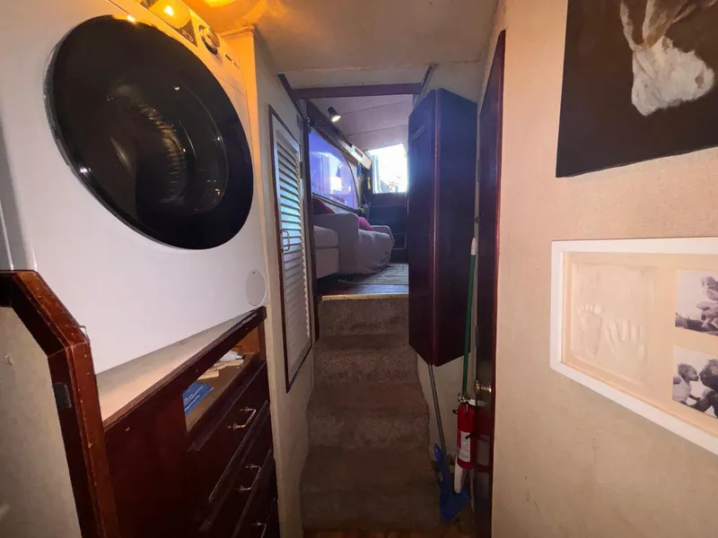Slide: The Image of Interior of 1979 Ocean Yachts Trawler with laundry area and stairs to cabin. - 47