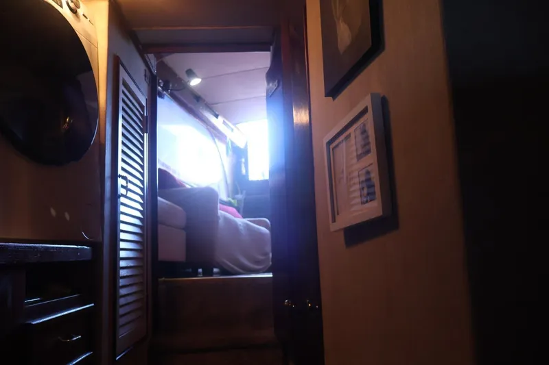 Slide: The Image of Interior view of 1979 Ocean Yachts Trawler, featuring cozy cabin and natural light. - 48