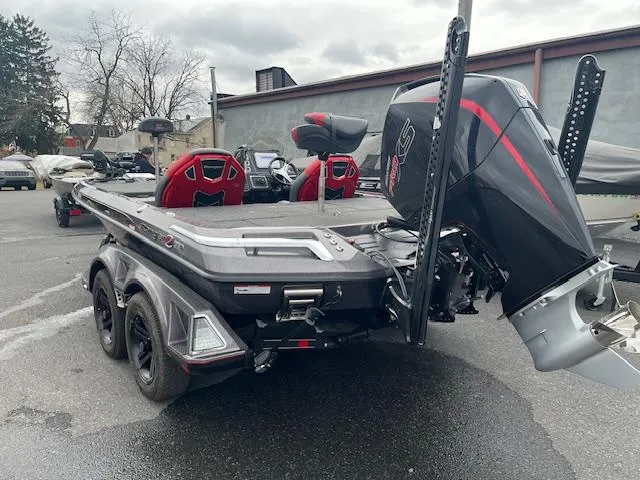 Slide: The Image of 2025 Ranger Z519R boat with powerful outboard motor, parked outdoors. - 10