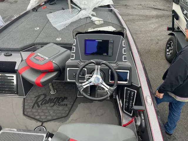 Slide: The Image of 2025 Ranger Z519R boat dashboard with steering wheel and electronic display. - 11