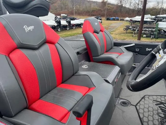 Slide: The Image of 2025 Ranger Z519R boat interior with red and gray seats. - 4