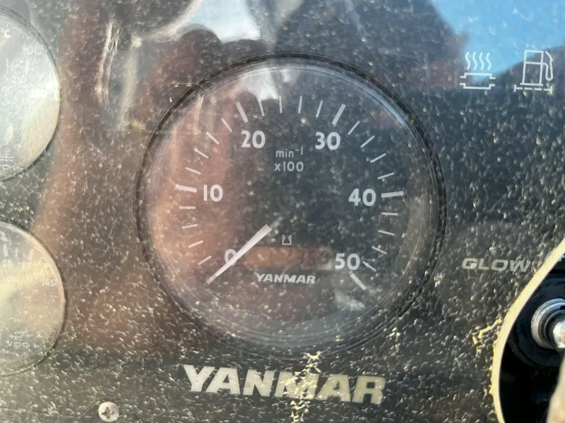 Slide: The Image of Yanmar tachometer on a 2005 Hunter 41 sailboat dashboard. - 16