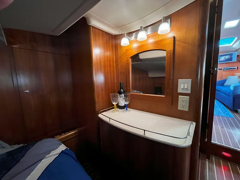 Slide: The Image of Luxurious 2005 Hunter 41 yacht interior with wooden cabinetry and elegant lighting. - 35