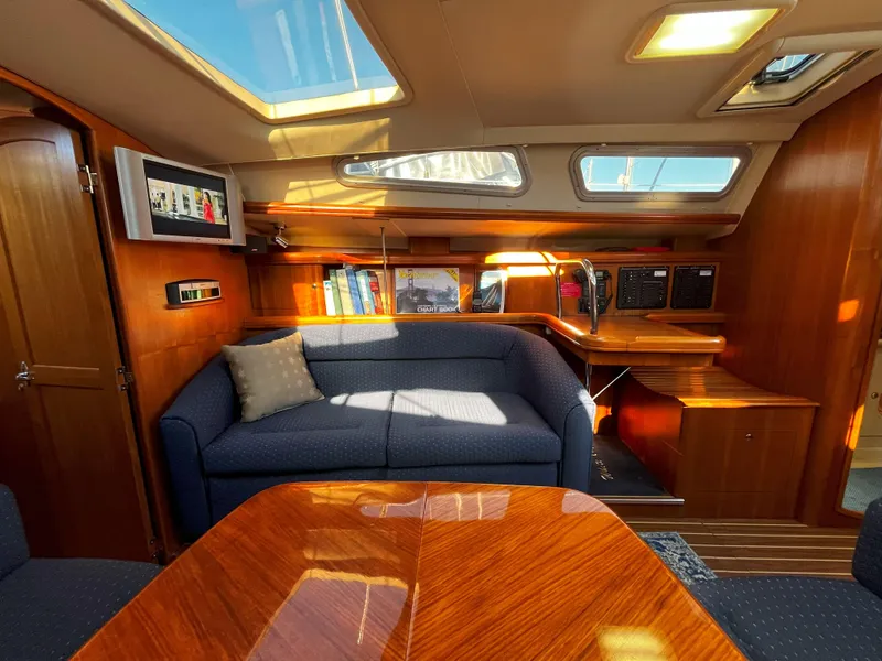 Slide: The Image of Interior of 2005 Hunter 41 sailboat with cozy seating and wooden finishes. - 40