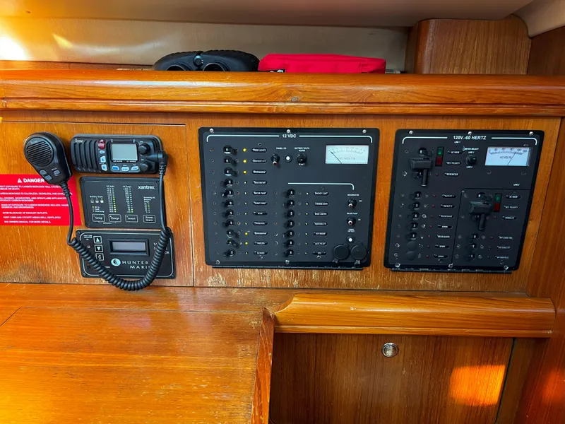 Slide: The Image of Control panel of a 2005 Hunter 41 sailboat with communication equipment. - 41