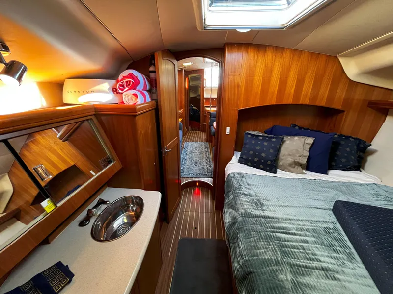 Slide: The Image of Luxurious interior of 2005 Hunter 41 yacht with cozy bedroom and wooden finishes. - 47