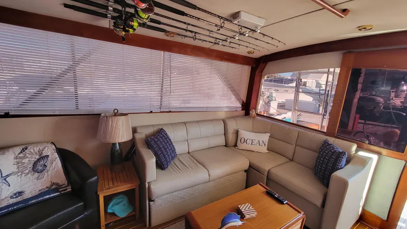 Slide: The Image of Interior of 1988 Ocean Yachts 38 Super Sports with cozy seating and nautical decor. - 10