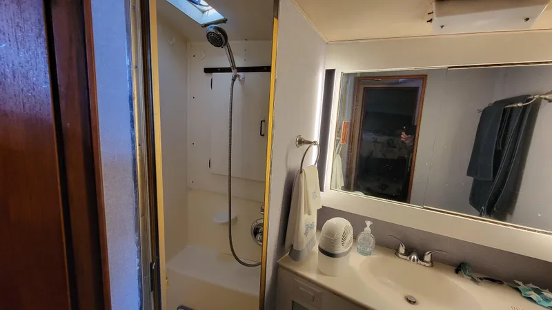 Slide: The Image of Bathroom interior of 1988 Ocean Yachts 38 Super Sports with shower and sink. - 23