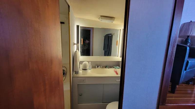 Slide: The Image of Bathroom interior of 1988 Ocean Yachts 38 Super Sports with mirror and sink. - 26