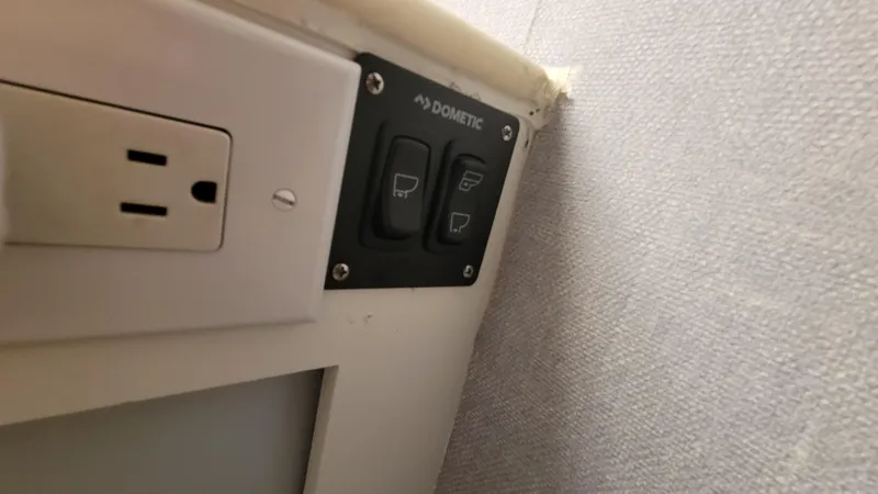 Slide: The Image of Control panel and outlet on 1988 Ocean Yachts 38 Super Sports. - 28