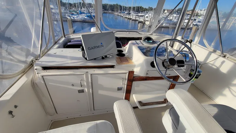 Slide: The Image of Interior helm of 1988 Ocean Yachts 38 Super Sports with Garmin navigation system. - 30