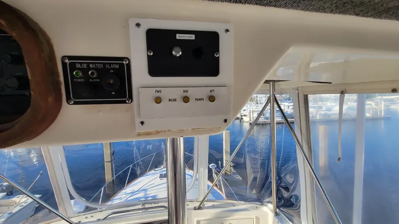 Slide: The Image of Control panel on 1988 Ocean Yachts 38 Super Sports boat, overlooking marina. - 32