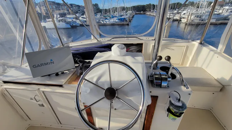 Slide: The Image of Cockpit of 1988 Ocean Yachts 38 Super Sports with Garmin navigation, docked at marina. - 35