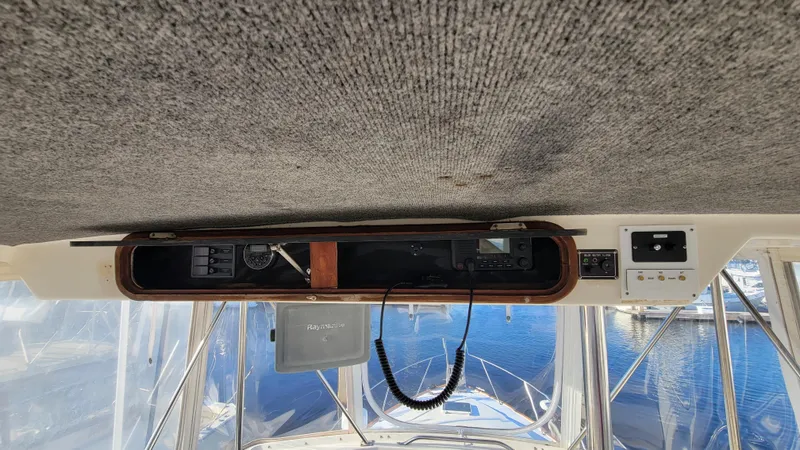 Slide: The Image of Interior view of 1988 Ocean Yachts 38 Super Sports, featuring control panel and marine electronics. - 37