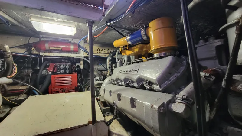Slide: The Image of Engine room of 1988 Ocean Yachts 38 Super Sports, showcasing mechanical components and equipment. - 39