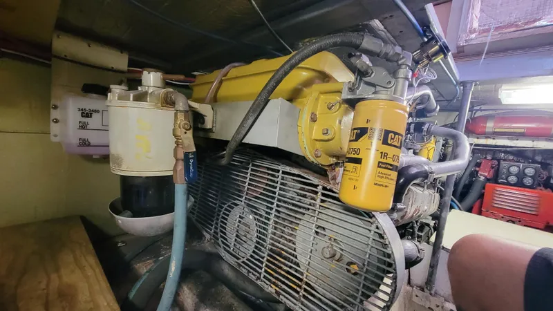 Slide: The Image of Engine room of 1988 Ocean Yachts 38 Super Sports with visible machinery and components. - 41