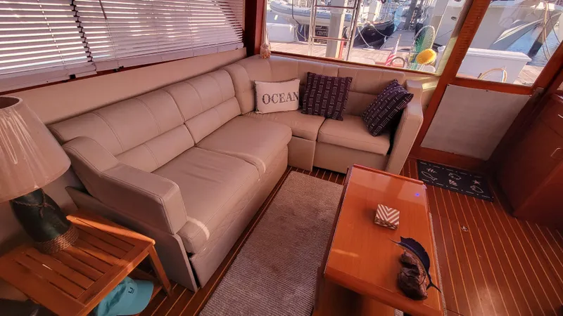 Slide: The Image of Luxurious 1988 Ocean Yachts 38 Super Sports interior with cozy seating and nautical decor. - 6