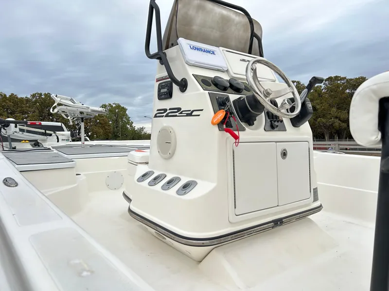 Slide: The Image of 2013 Epic 22 SC boat console with steering wheel and controls. - 12