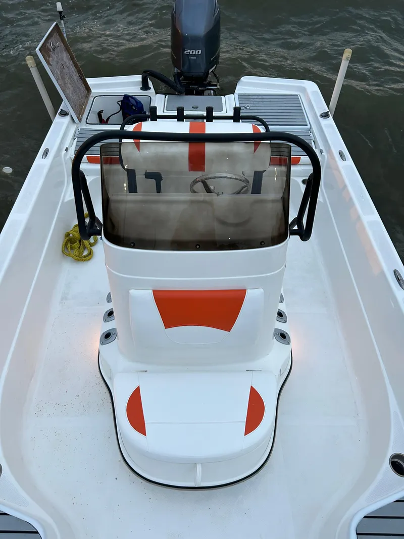 Slide: The Image of 2013 Epic 22 SC boat with orange accents and outboard motor on water. - 16