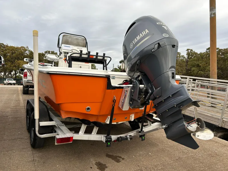 Slide: The Image of 2013 Epic 22 SC boat with Yamaha outboard motor on trailer. - 19
