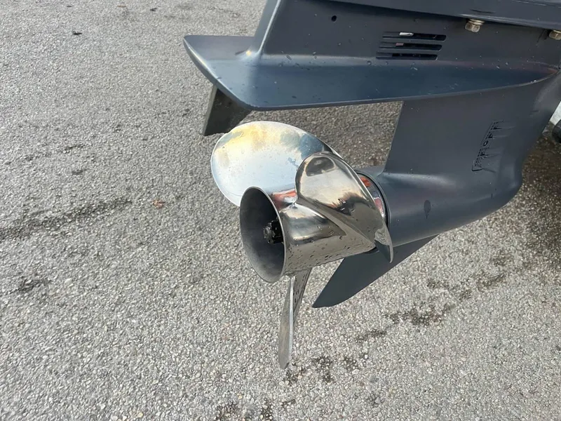 Slide: The Image of 2013 Epic 22 SC boat propeller on asphalt surface. - 26