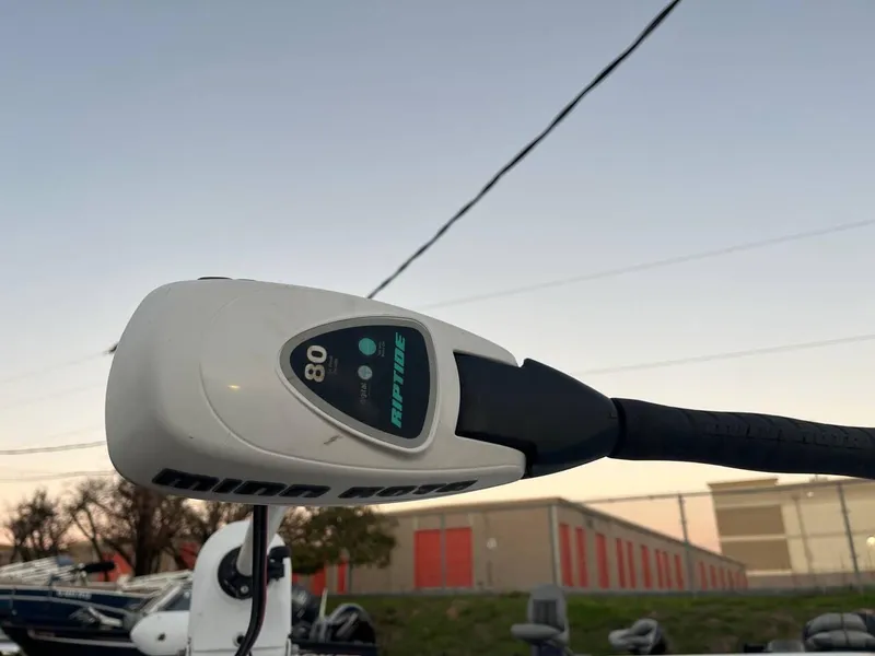 Slide: The Image of Minn Kota trolling motor on 2013 Epic 22 SC boat at sunset. - 30