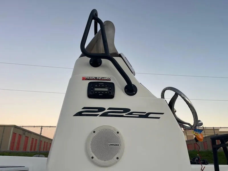 Slide: The Image of 2013 Epic 22 SC boat console with steering wheel and speaker. - 33