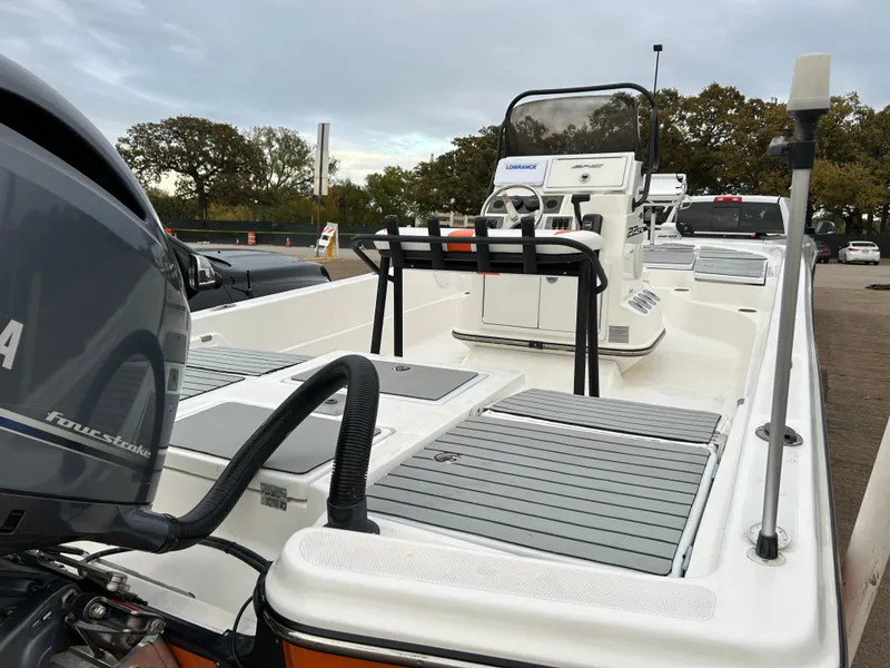 Slide: The Image of 2013 Epic 22 SC boat with Yamaha outboard motor, parked outdoors. - 46