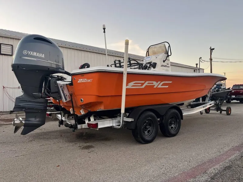 Slide: The Image of Orange 2013 Epic 22 SC boat with Yamaha outboard motor on a trailer. - 6