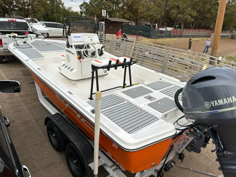 Slide: The Image of 2013 Epic 22 SC boat with Yamaha motor on trailer, parked outdoors. - 7