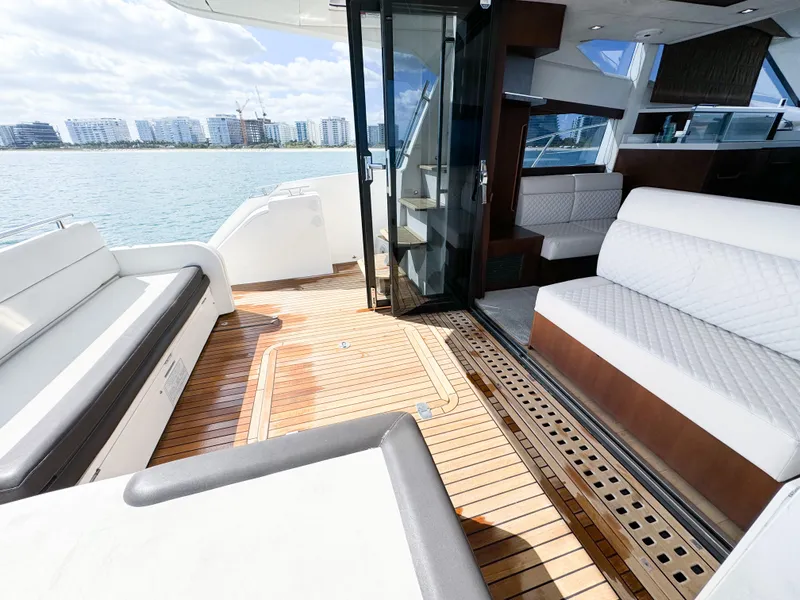 Slide: The Image of 2016 Galeon 420 Fly yacht interior with elegant seating and wooden flooring. - 12